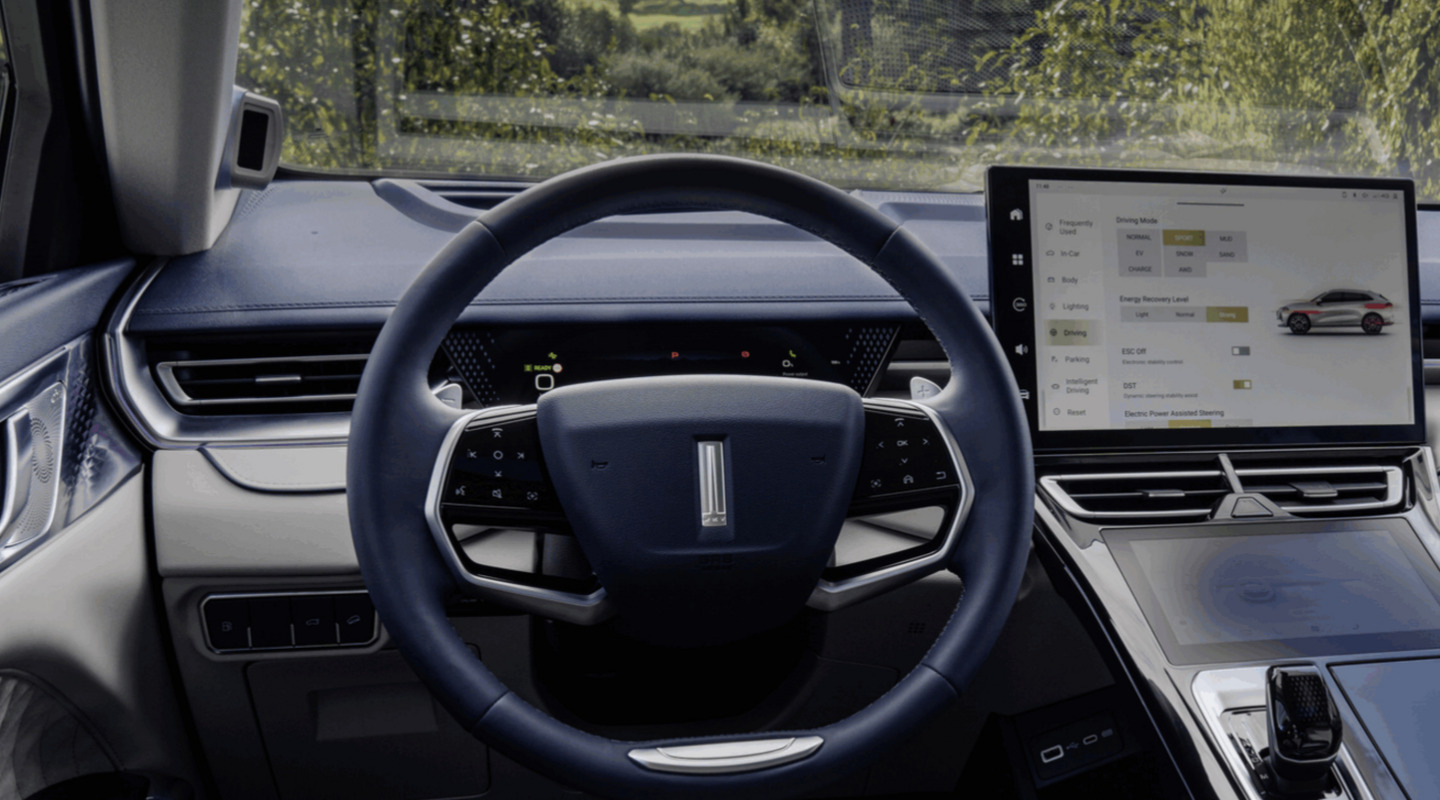 interior shot of a wey coffee 01 car showing the driver's point of view of the steering wheel and the infotainment display