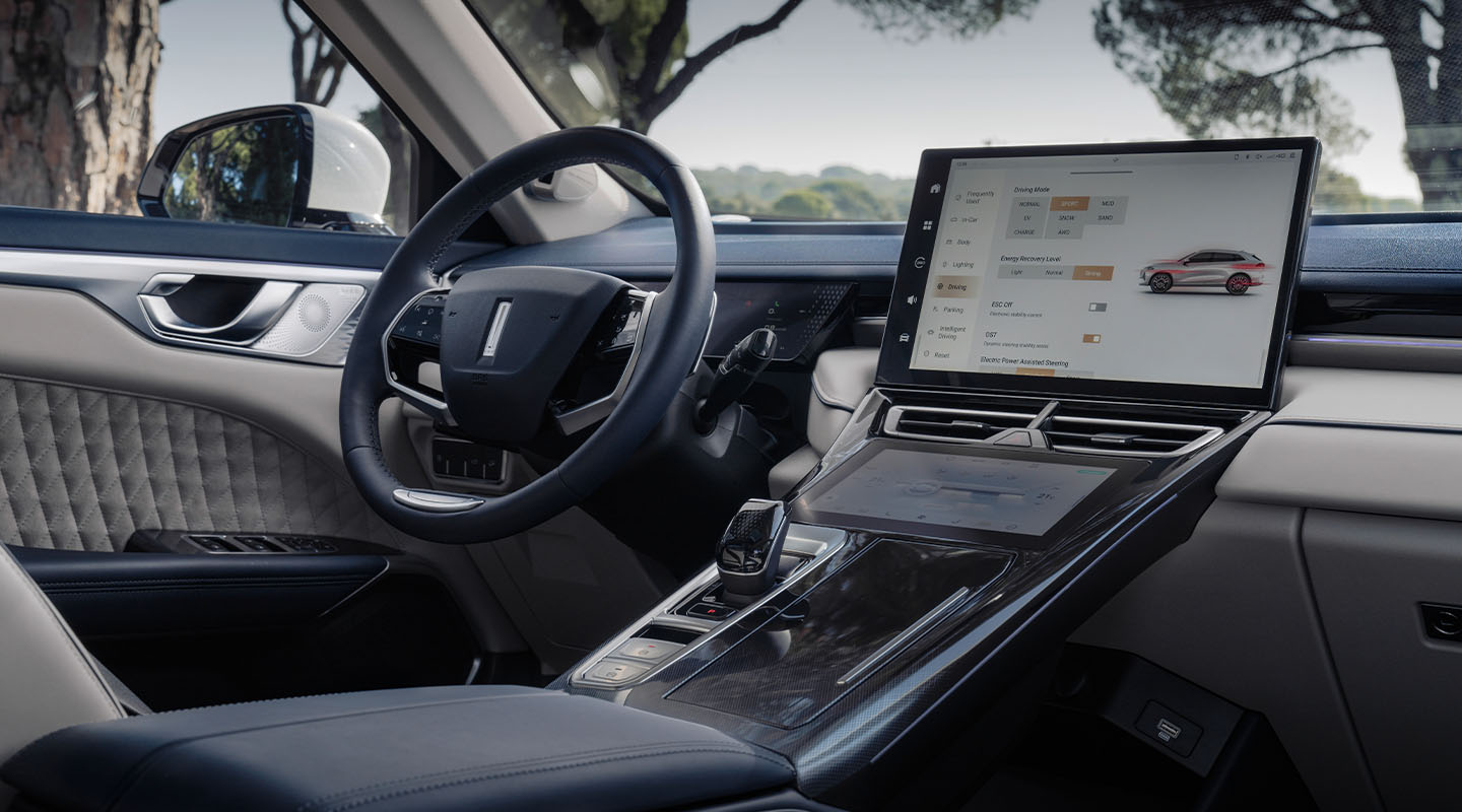 interior shot of a wey coffee 01 car showing  steering wheel and the infotainment display