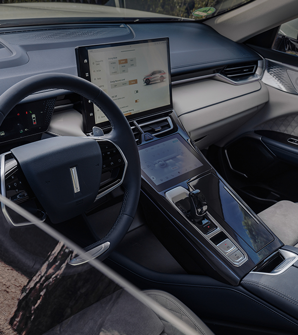 the interior of the wey 05 car showing the steering wheel and the infotainment display